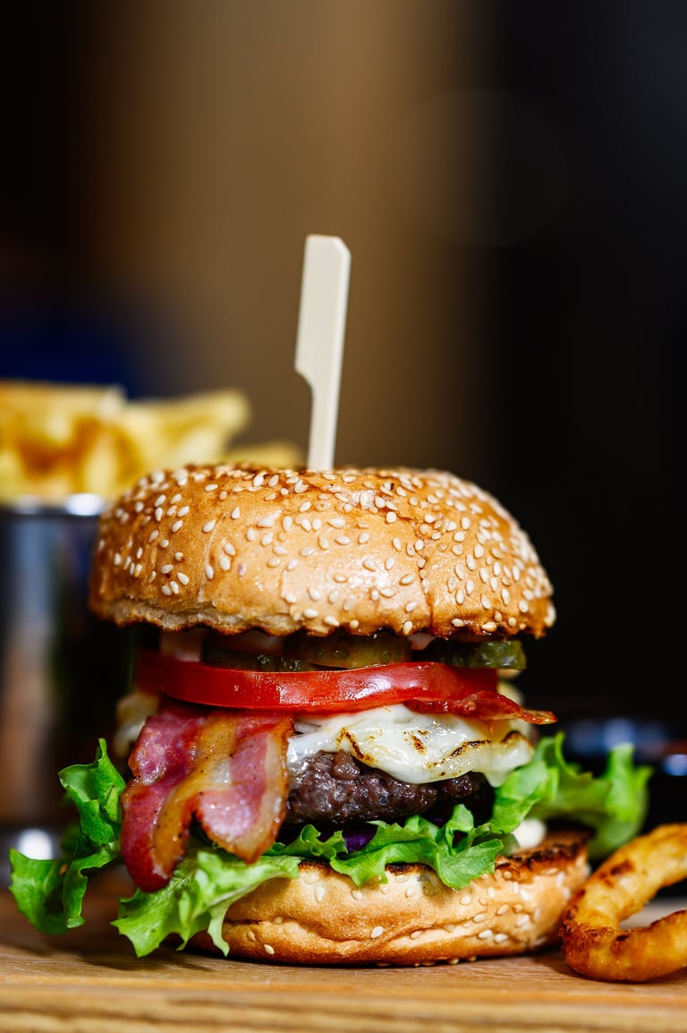 Burger and fries on wooden board