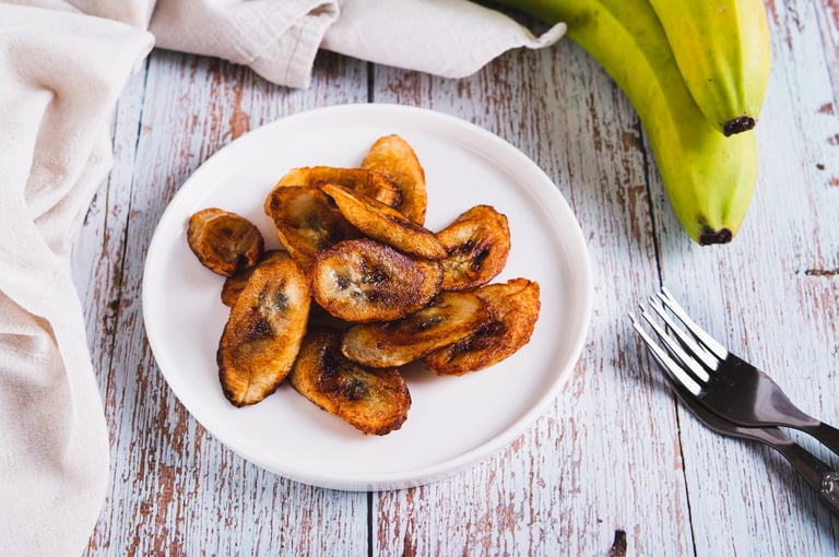 Tajadas fried banana on a plate on the table