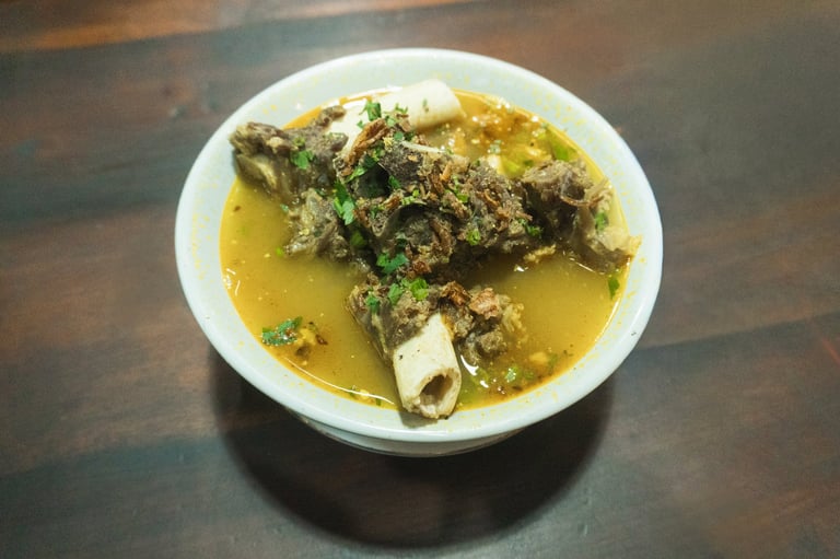 Goat curry traditional Indonesian dish in spicy yellowish sauce