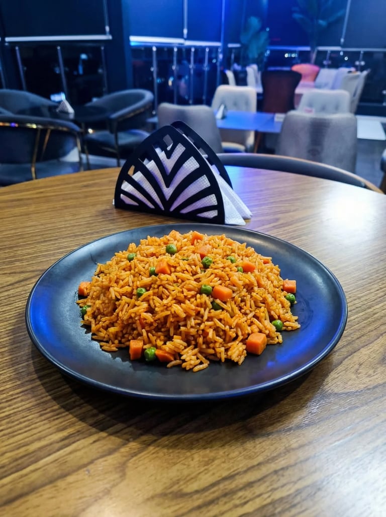 Plate of orange fried rice with vegetables on a wooden table in a modern lounge setting