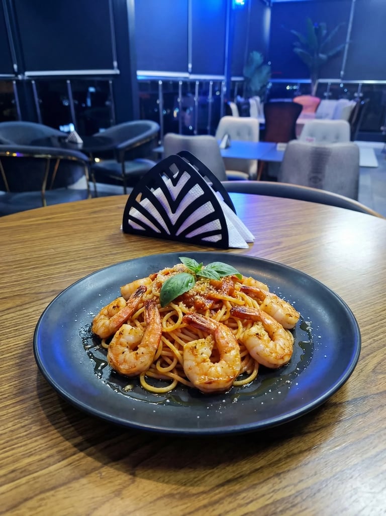 Plate of spaghetti with shrimp and fresh basil on a wooden table in a modern restaurant with blue lighting